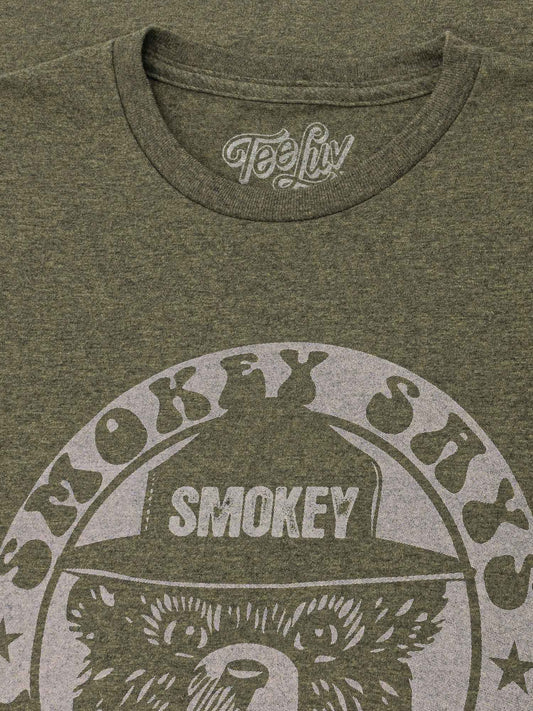 Forest green heather T-shirt with Smokey bear graphic and Smokey text