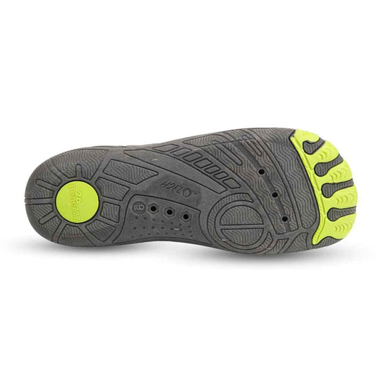 Shoe outsole with gray tread and bright neon-green traction pods, sport sole