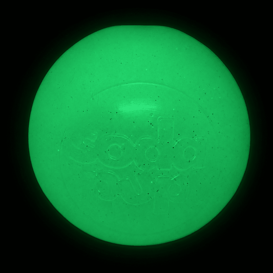 Glow-in-the-dark glitter dog ball, bright green with embossed paw-face pattern