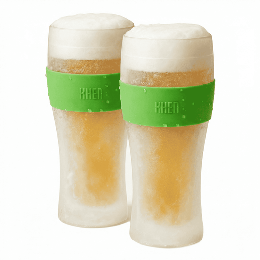 Pair of tall acrylic beer glasses with green bands, frosted tops and amber beer with foam