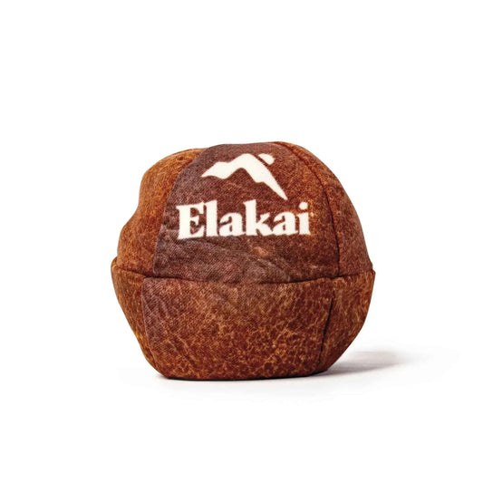 Elakai suede footbag, weathered brown top patch with white Elakai lettering