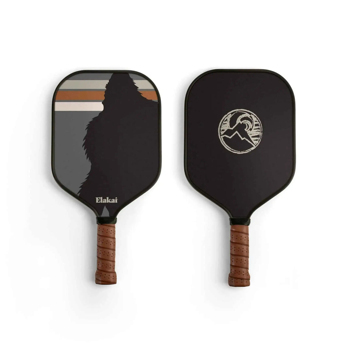Elakai pickleball paddle with black face, white emblem, and cork-brown handle