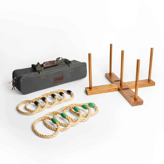 Ring toss game set with wooden peg stand, rope rings with green beads, and soft case