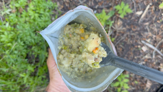 Freeze-dried chicken pot pie in pouch, clear bag with chunked creamy mixture