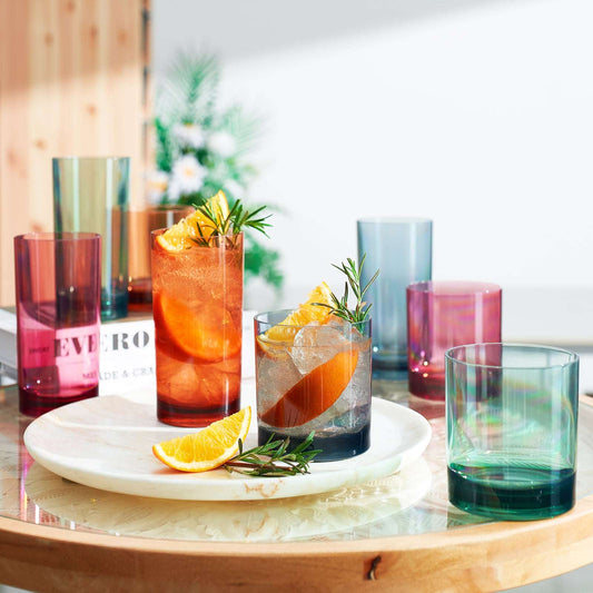 Set of eight tinted acrylic highball and lowball glasses with citrus and herbs
