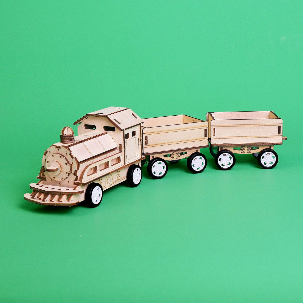Assembled wooden motorized train on wheels with engine cab and open cargo car