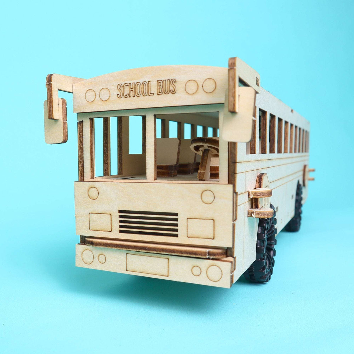 Unfinished wooden school bus STEM kit model front view with wheels