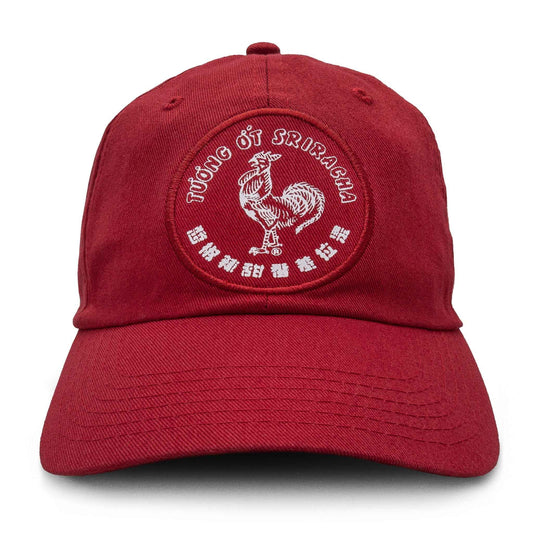 Red baseball cap with embroidered rooster logo and curved text on front