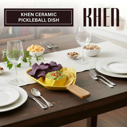 Multicolor ceramic pickleball paddle serving dish holding chips, dip, and snacks