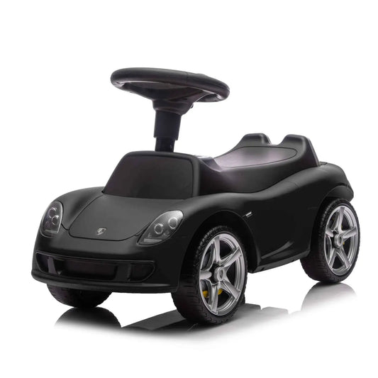 Black Porsche 911 ride-on car front 3/4 view with sculpted hood and silver wheels