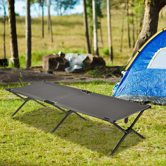 Gray folding camping cot with black metal legs and fabric mattress.
