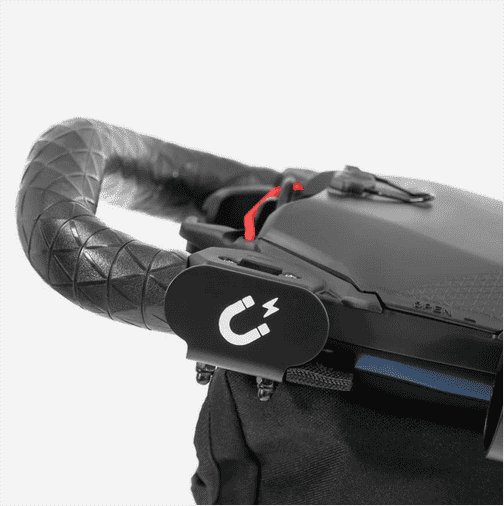 Black push-cart handle grip with control pad and padded armrest