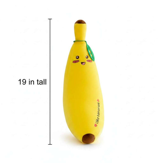 Yellow banana plush upright with smiling face and green leaf top, round opening at base