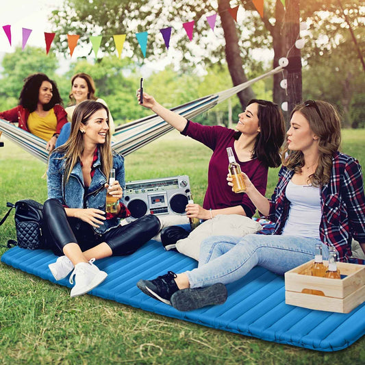 Blue inflatable camping sleeping pad used for group camping lounging