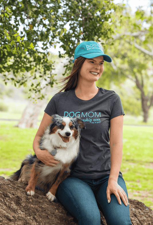 Turquoise embroidered Dog Mom baseball cap on a woman, curved brim