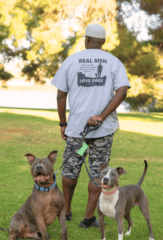 Light blue T-shirt with back graphic text "REAL MEN LOVE DOGS" and dog silhouettes