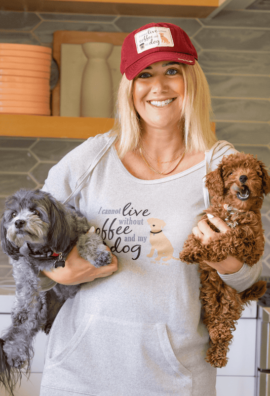 Maroon baseball cap with embroidered dog-face graphic, worn with adjustable strap