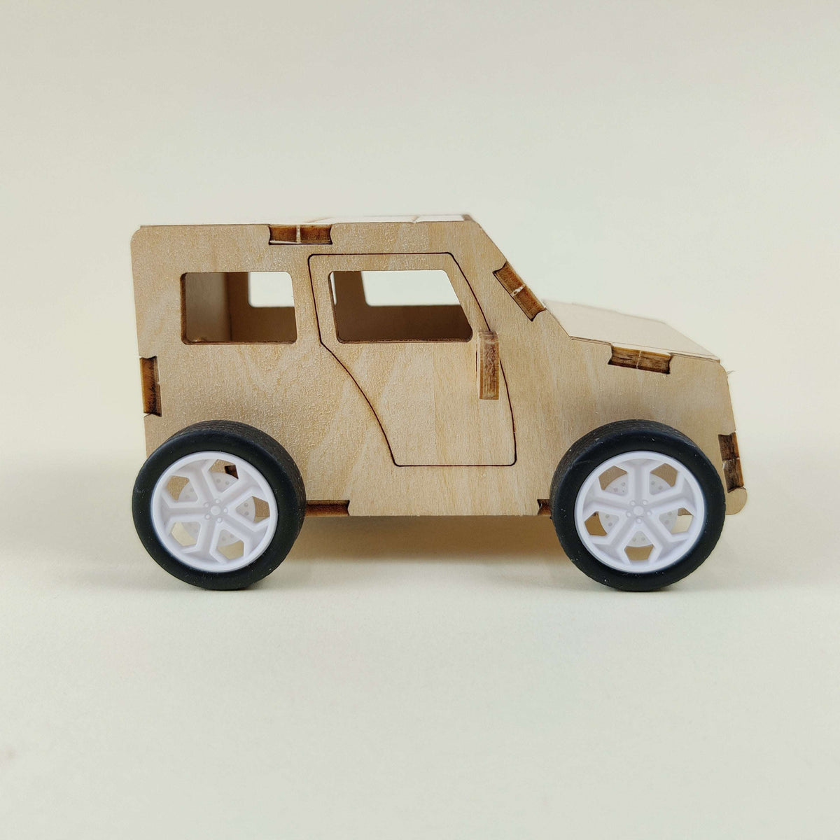 Wooden pull-string toy car body with windows and white spoked wheels, side view