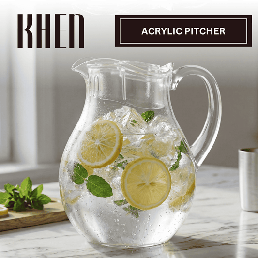 Acrylic pitcher with lid and handle, filled with lemon slices and ice chunks