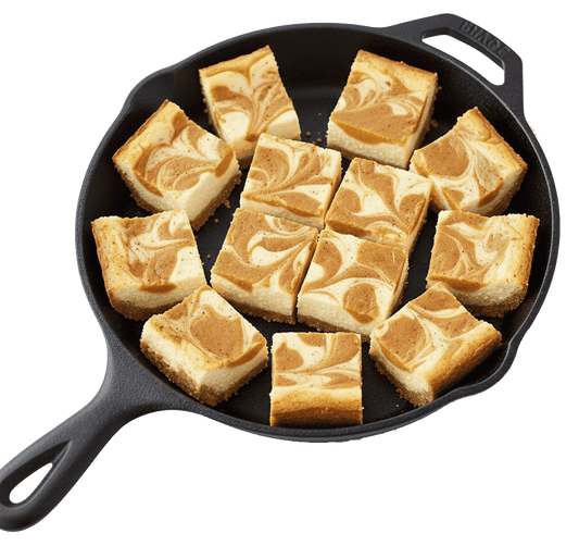 Skillet with freeze-dried pumpkin cheesecake bites, cubed pieces with speckled top