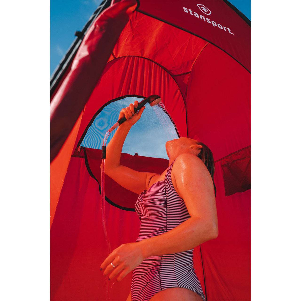 Red tent doorway with mesh window and zippered interior access panel