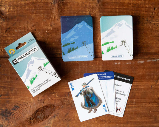 Ski card game deck and instruction card set on wooden table