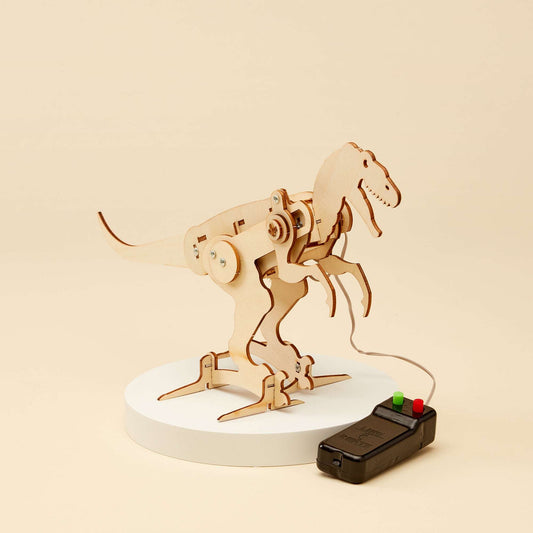 Assembled T-Rex robot figure on white oval base with black controller