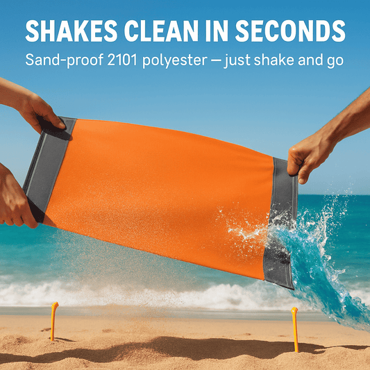 Orange and gray picnic blanket being shaken to remove sand from the fabric
