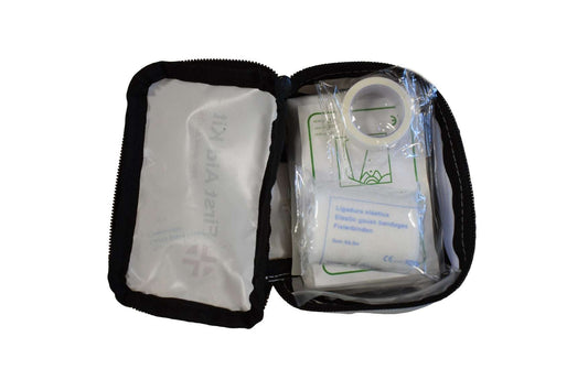 First aid kit pouch open with divider panel and wrapped medical items