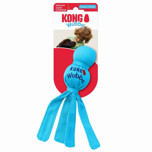 KONG Wubba plush dog tug toy, blue ball with dangling straps on retail package