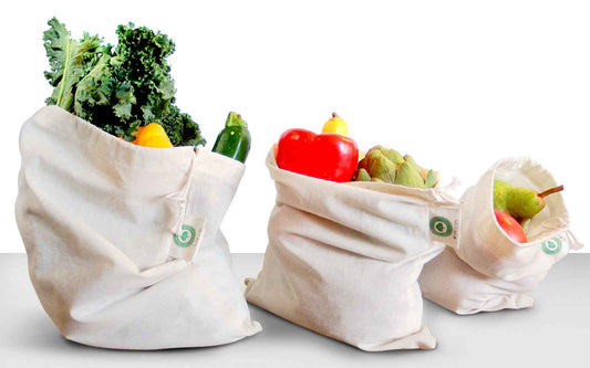 Organic cotton muslin produce bags with gathered tops, holding vegetables