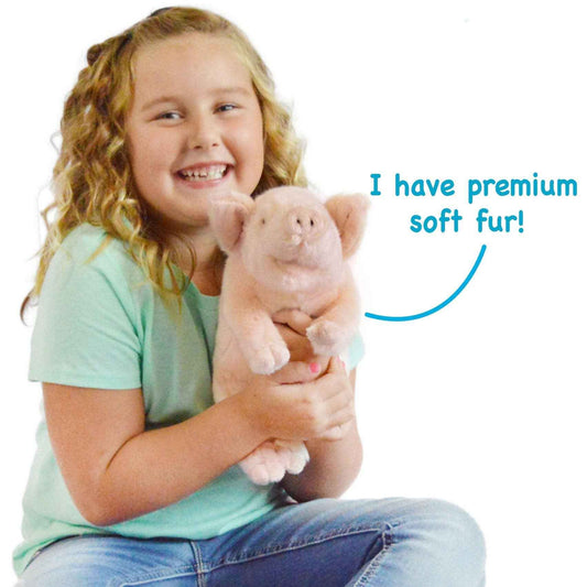 11-inch plush pig, held by a child in a mint green shirt