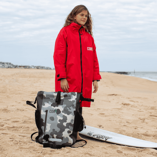 Red hooded waterproof swim parka with front zipper and adjustable cuff closure