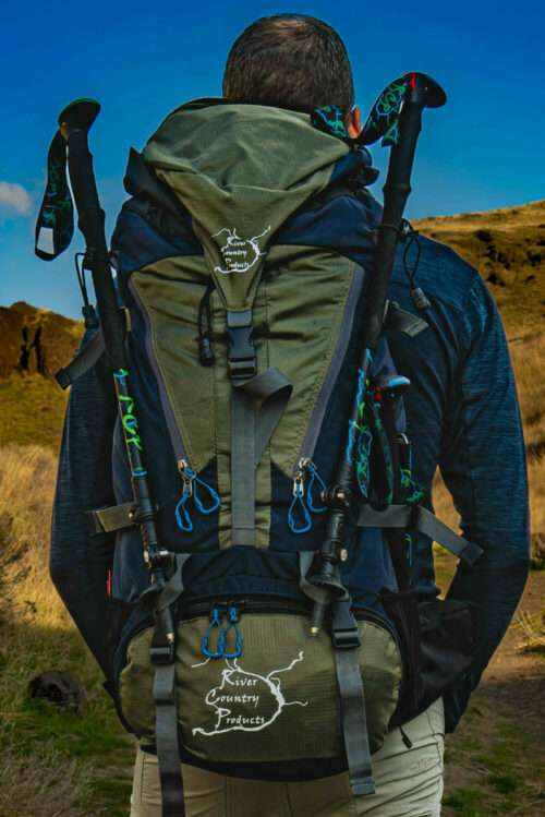 Back view of a 65L backpack with olive fabric, black straps, and mesh paneling