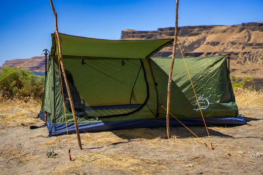 Ultralight 1-person bivy-style tent with green walls, black mesh door panel, blue base