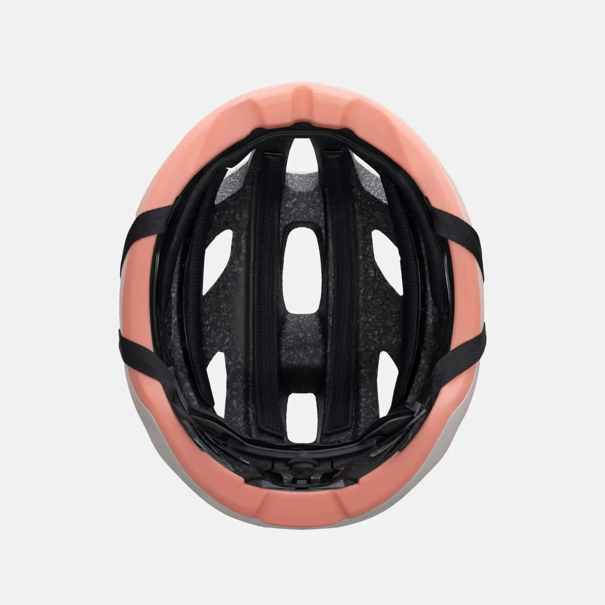 Bike helmet interior with black padding and straps, light pink outer shell