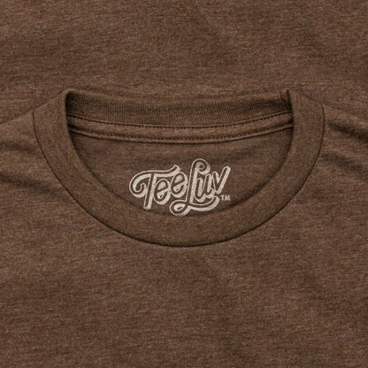 Brown T-shirt neckline with Teefy logo patch on the crew collar