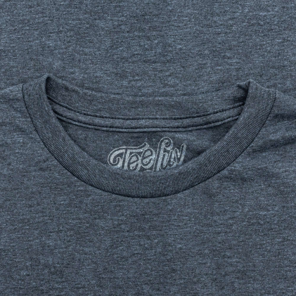 Indigo heather crewneck tee with 'TeeLuv' label on the neckline