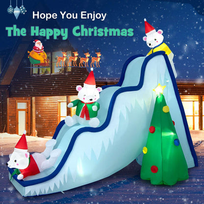 Inflatable polar bear slide with three bears, blue rails and a light-up Christmas tree