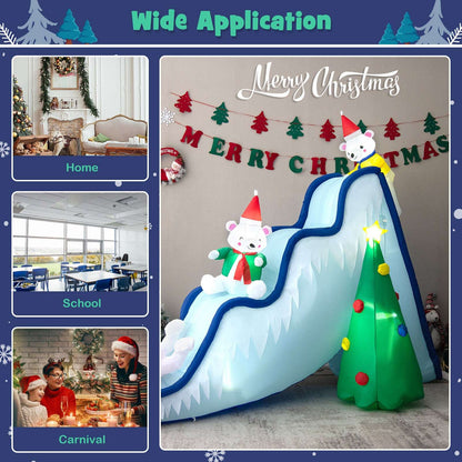 Inflatable polar bear Christmas slide with blue rails, bear figures and a light-up tree