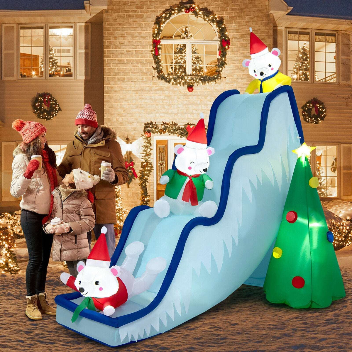 Inflatable polar bear Christmas slide with three bears, blue rails and a light-up tree