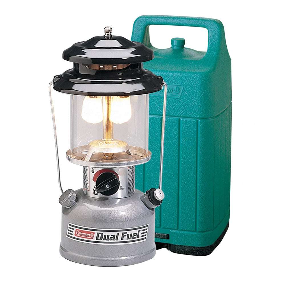 Dual fuel lantern with black top, glass chimney, silver body, teal carry case
