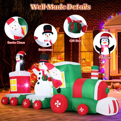 Inflatable Christmas train with close-up details of Santa, snowman, gift, and penguin