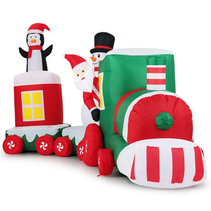 Inflatable train engine with a striped front, Santa, snowman, and penguin figures