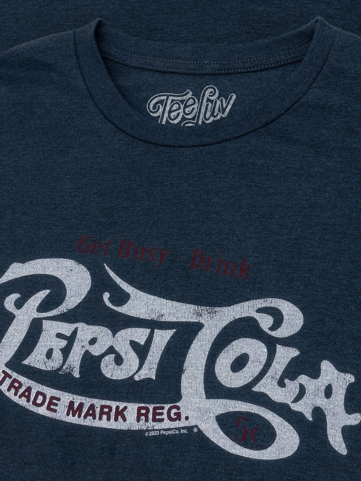 Navy crew-neck T-shirt close-up with TeeLuv neck logo and Pepsi graphic