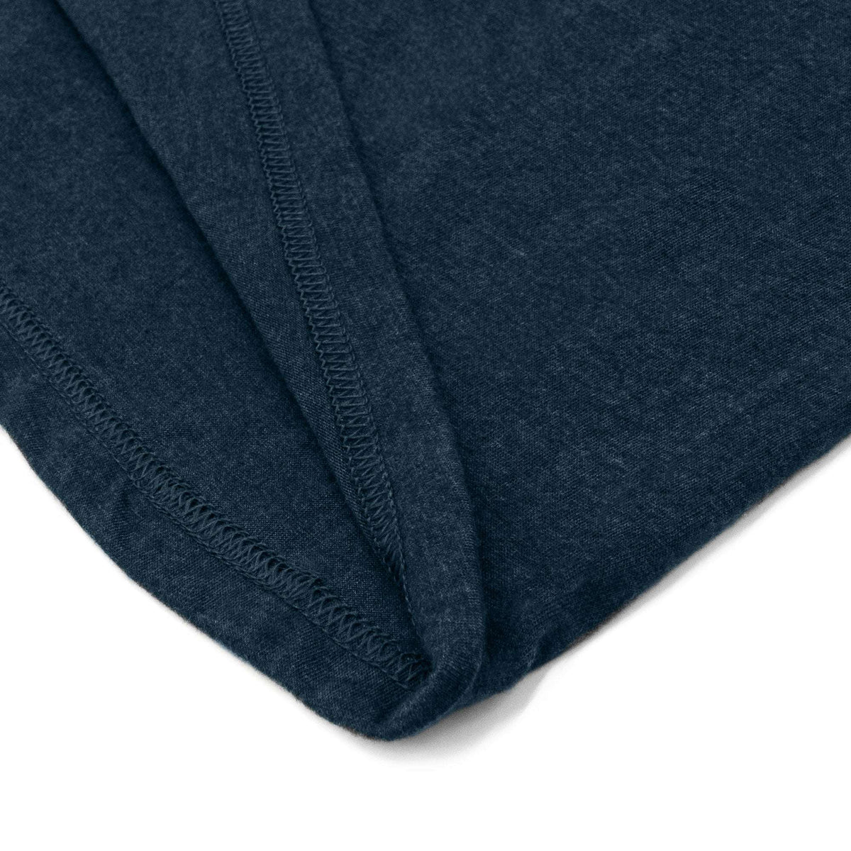 Navy T-shirt corner showing double-stitched hem
