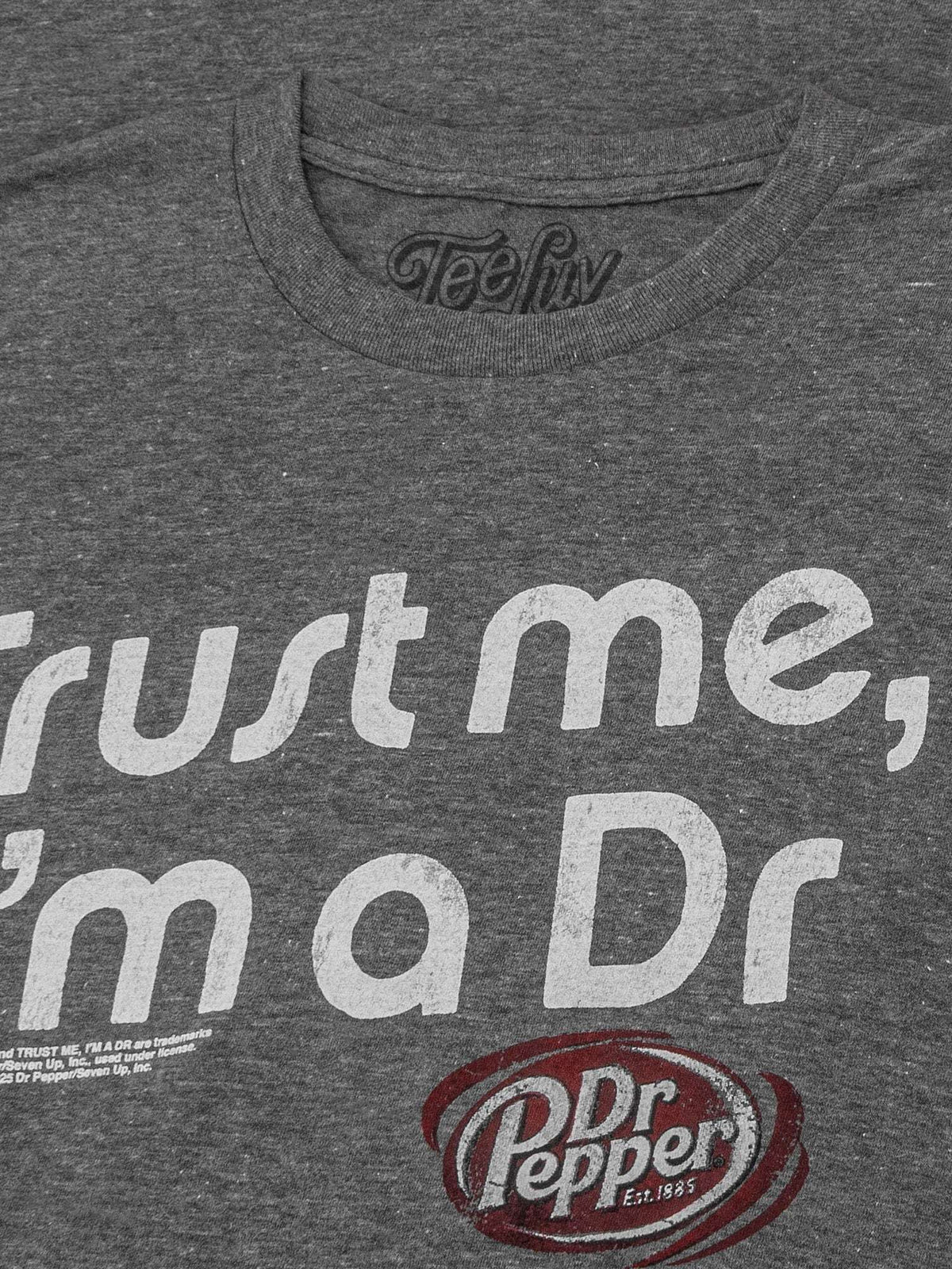 Dark heather T-shirt front close-up with large “Trust me, I’m a Dr” text and Dr Pepper emblem