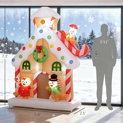 Inflatable gingerbread house decoration shown beside a height scale, with candy details and figures