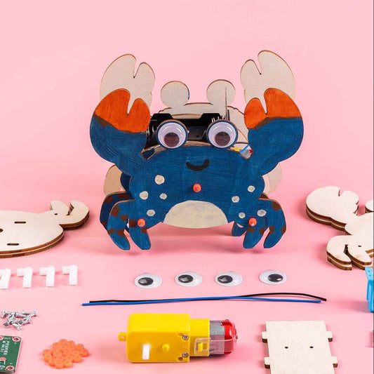 Blue painted walking crab toy with round eyes; construction pieces and tools visible