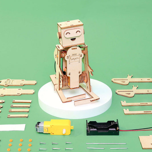 Wooden walking robot model with parts laid out around the standing frame
